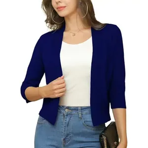 Close-up detail of an elegant navy blue 3/4 sleeve short knit shrug cardigan for women