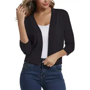 Elegant black short-sleeved open front knit cardigan for women presented on a model