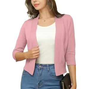 Close-up of a pink three-quarter sleeve cropped knitted cardigan jacket for women