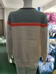 Back view of a women's color-block knit sweater in grey, orange and cream finish