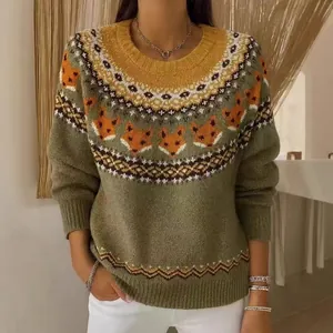 Detailed view of a cozy green knitted sweater with a unique orange fox Fair Isle pattern