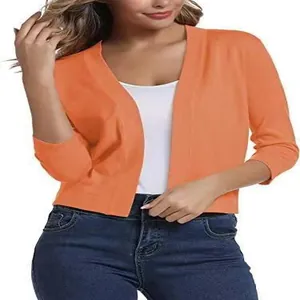 Detail view of a women's elegant orange short-sleeved knit cardigan jacket