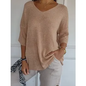 Elegant V-neck knit sweater featuring three-quarter sleeves and a subtle textured finish