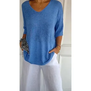 Fashionable blue V-neck knit sweater with three-quarter sleeves on female model