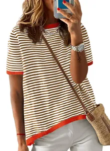 Close-up of striped knit short sleeve sweater with orange contrast ribbing