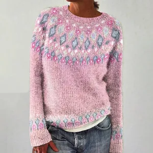 Detailed macro view of women's pink crewneck knit sweater with colorful geometric pattern