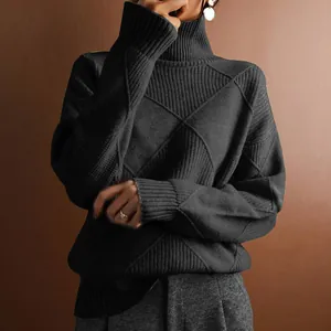 Detailed view of a stylish black turtleneck sweater featuring a unique diamond knit pattern