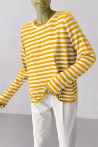 Detailed view of the yellow and white horizontal striped knit sweater with round neck.