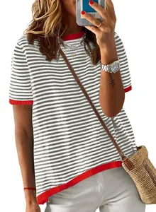 Detailed view of women's striped knit short sleeve top with vibrant red ribbed trim