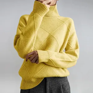 Close-up of vibrant yellow turtleneck sweater featuring a stylish diamond knit pattern