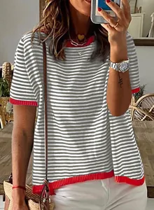 Close-up detail view of a grey and white striped knit top with vibrant red ribbed trim.