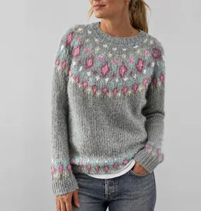 Detailed view of women's grey knit sweater featuring a colorful jacquard pattern
