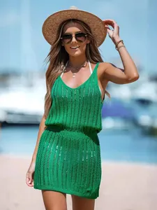 Stylish green sleeveless hollow-out knit vacation mini dress perfect for beach outings