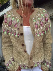 Detailed view of bohemian geometric pattern on a women's oversized knit cardigan sweater