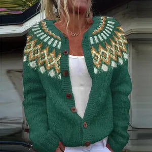 Close-up detail of a green knitted cardigan featuring colorful geometric shoulder patterns.