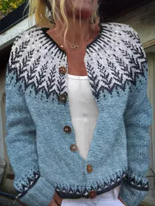 Close-up of women's blue Fair Isle knitted cardigan with wooden buttons