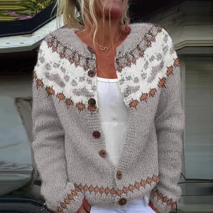 Close-up of a women's gray knit cardigan with white and orange geometric patterns.