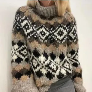 Close-up detail of vintage geometric jacquard pattern on a cozy loose turtleneck knit sweater