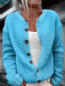 Detailed view of a bright blue women's loose knit cardigan with wooden buttons