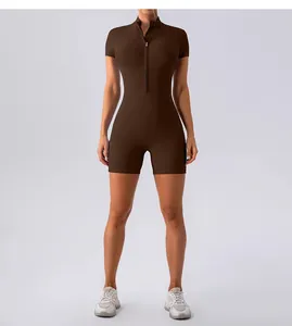Front view of a brown short-sleeved yoga bodysuit featuring a slim fit and half-zip