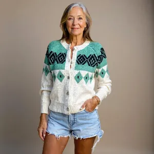 Detailed view of a loose knit cardigan with geometric green and white patterns