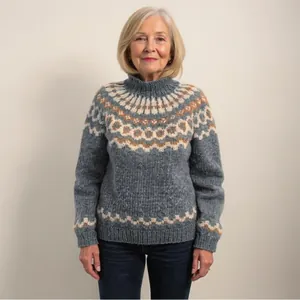 Detailed view of women's chunky Fair Isle knit sweater with classic turtleneck design
