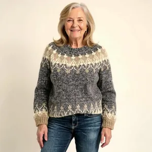 Senior woman in cozy grey and beige Nordic patterned knit pullover sweater for autumn