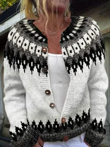 Detailed close-up of women's white knit cardigan with black geometric pattern and wooden buttons