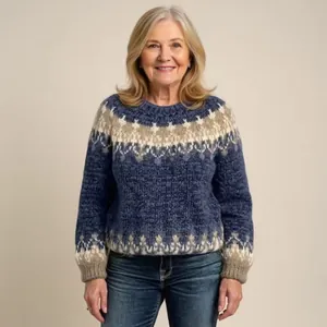 Elegant women's blue knitted sweater featuring traditional fair isle patterns in a loose fit