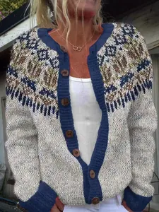Detail view of a vintage Fair Isle knit cardigan with wooden buttons and blue trim