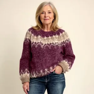 Detailed view of women's purple patterned knit sweater with a stylish loose fit design.