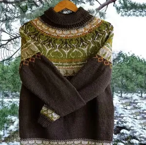 Detail of women's knitted sweater with vintage fair isle pattern in green and brown