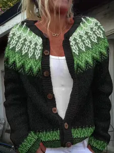 Close-up of women's loose knit cardigan with green fair isle pattern and wooden buttons