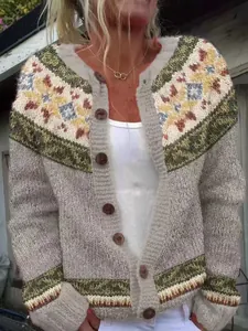 Detailed view of women's knitted cardigan with colorful Nordic pattern and buttons