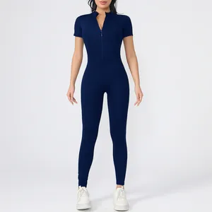 Detail of navy blue high-stretch short sleeve bodysuit with front zipper for yoga.
