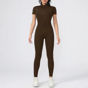 Front full body view of solid brown short sleeve zipper yoga jumpsuit for women fitness