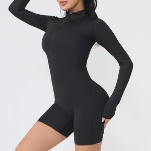 Mono de yoga negro de manga larga con cremallera frontal para fitness de mujer