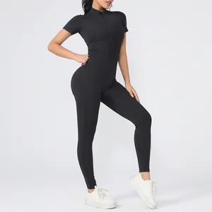 Full-body view of a black short-sleeve athletic bodysuit with front zipper for fitness.