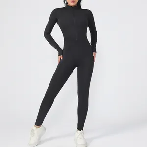 Detail view of black long sleeve zipper yoga jumpsuit showing fit and high-stretch fabric.