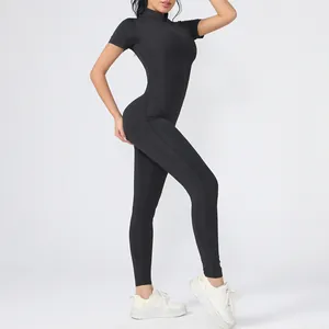 Close-up detail of a black high-stretch short-sleeve jumpsuit for fitness yoga workout