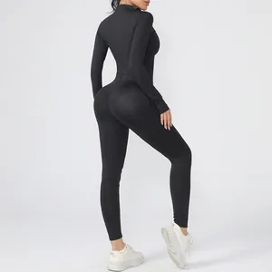 Close-up detail of a black long sleeve yoga jumpsuit showing the form-fitting back profile