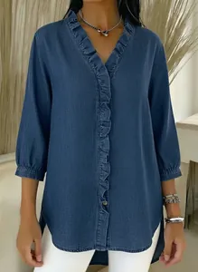 Close-up of blue faux denim shirt featuring ruffled V-neck and three-quarter sleeves