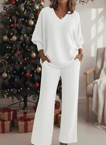Cozy white sequined two-piece loungewear set for women in festive holiday setting