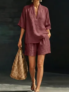 Women's V-neck linen-look two-piece set in dusty rose with a woven straw bag