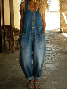 Detailed view of women's retro denim-look sleeveless jumpsuit with front pockets