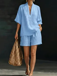 Light blue linen V-neck short sleeve top and shorts set with woven bag detail