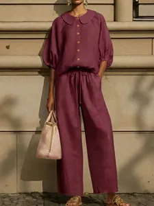 Elegant maroon cotton linen set with lantern sleeves and wide-leg drawstring trousers.