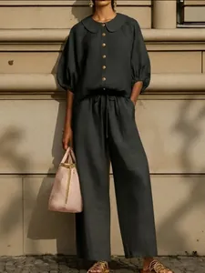 Detail view of cotton linen shirt with Peter Pan collar and matching wide-leg pants