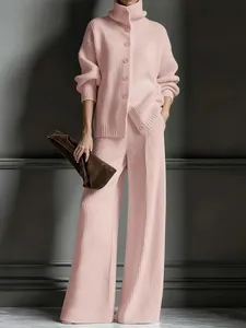 Elegant pink ribbed knit two-piece set featuring high-neck cardigan and wide-leg trousers