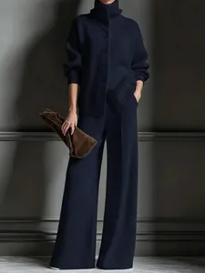 Elegant navy blue knitted two-piece set featuring high-neck cardigan and wide-leg pants